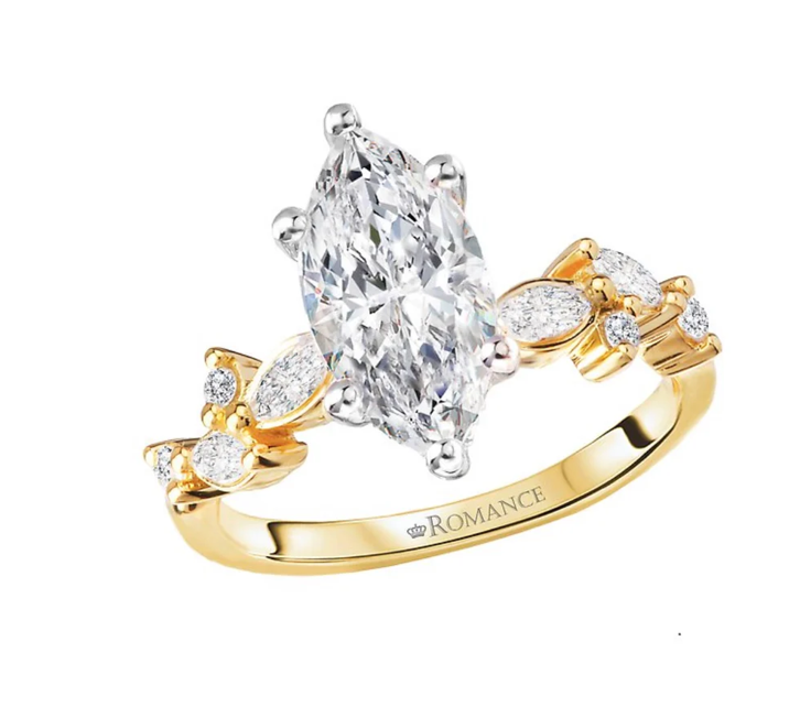 A yellow gold engagement ring features a marquise-cut center diamond. The band includes clusters of accent diamonds.