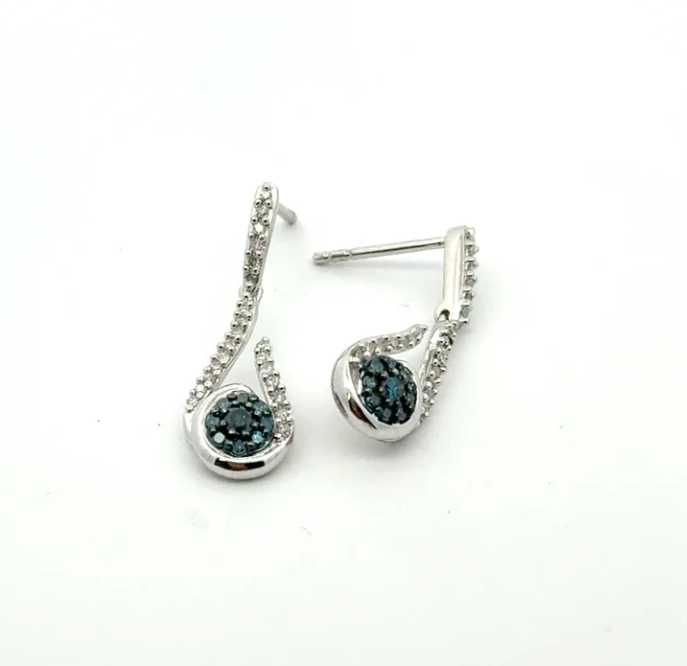 A pair of silver-tone drop earrings features round blue-green stones surrounded by small clear accent stones.